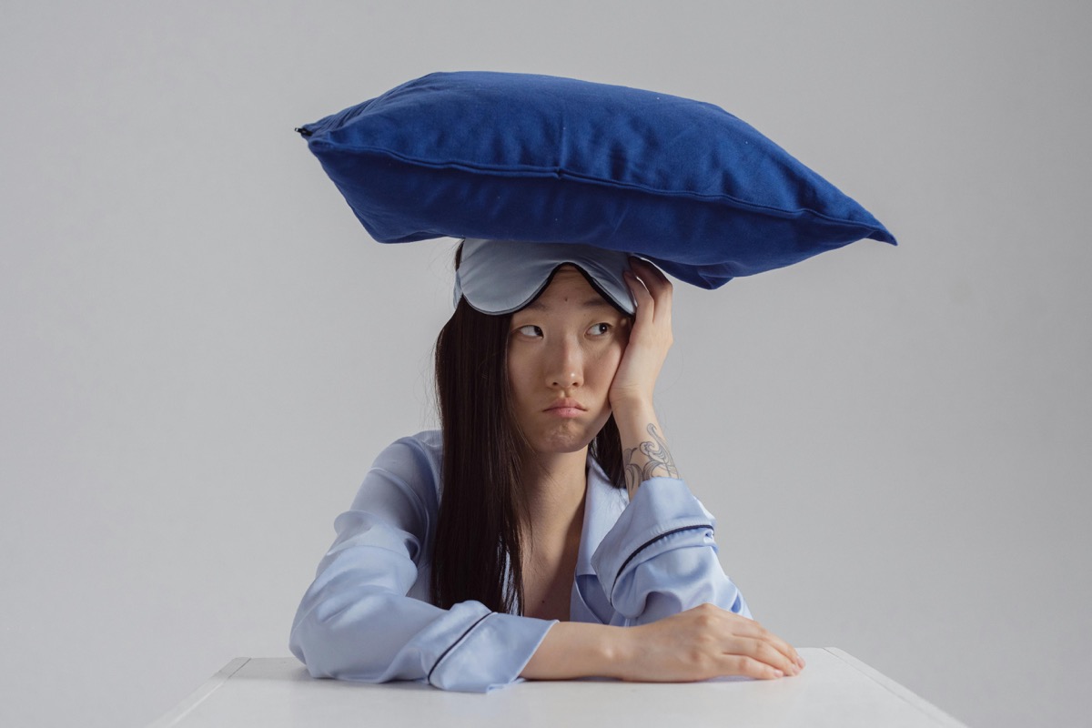 Woman exhausted and unable to sleep